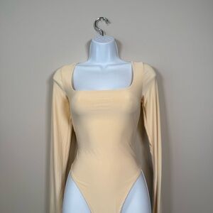 Fashion Nova Cream Long Sleeve Bodysuit